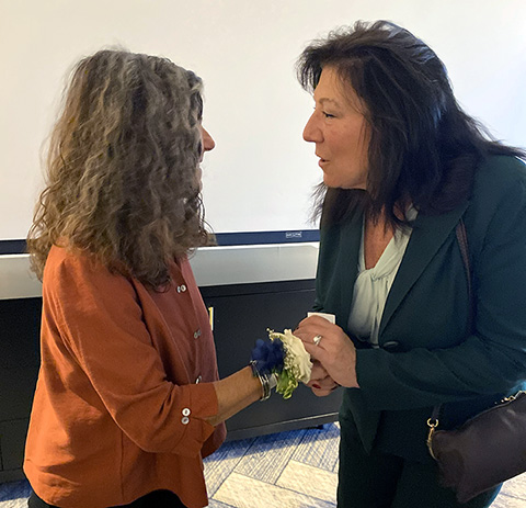 on left honoree Elise Gold, on right, Dutchess County Executive Sue Serino.