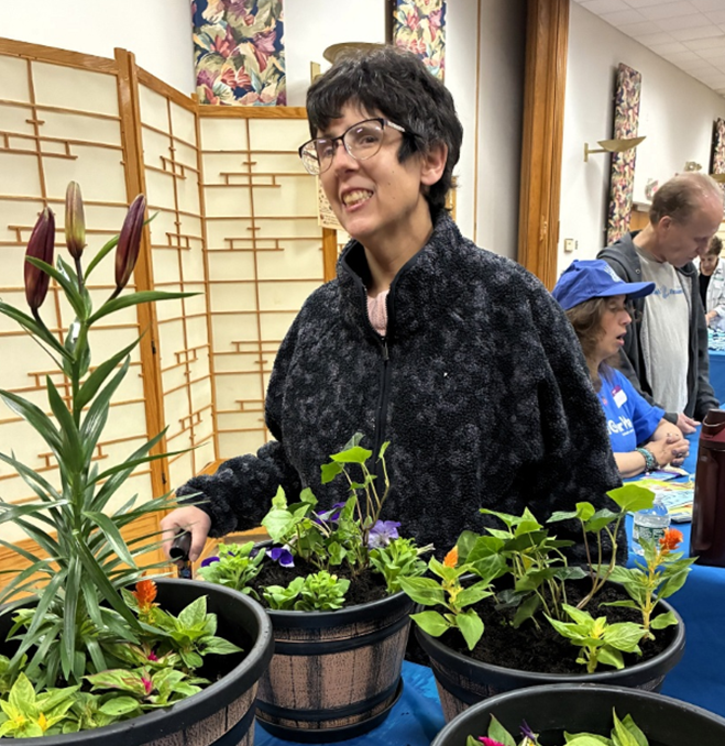 Alison Heady gardening at Congregation Schomre Israel